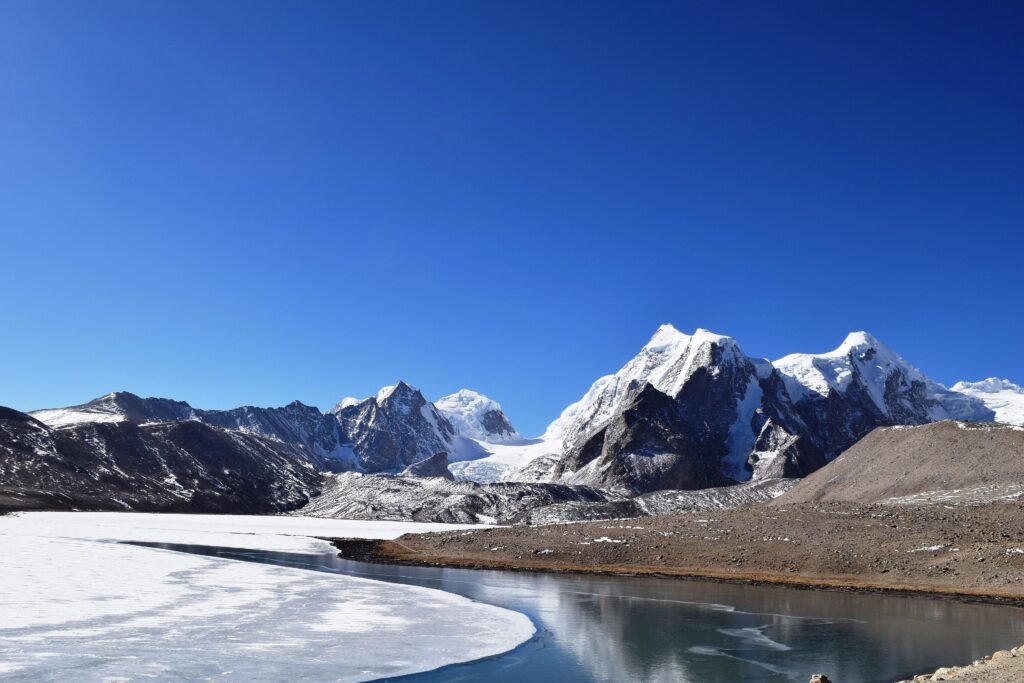 Gurudongmar Lake in North Sikkim, a high altitude glacial lake below bare Himalayan ridges