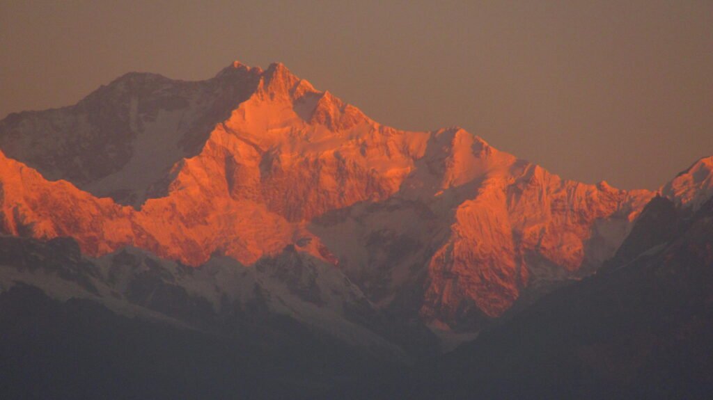 Kangchenjunga catching first light above the ridges seen from Darjeeling