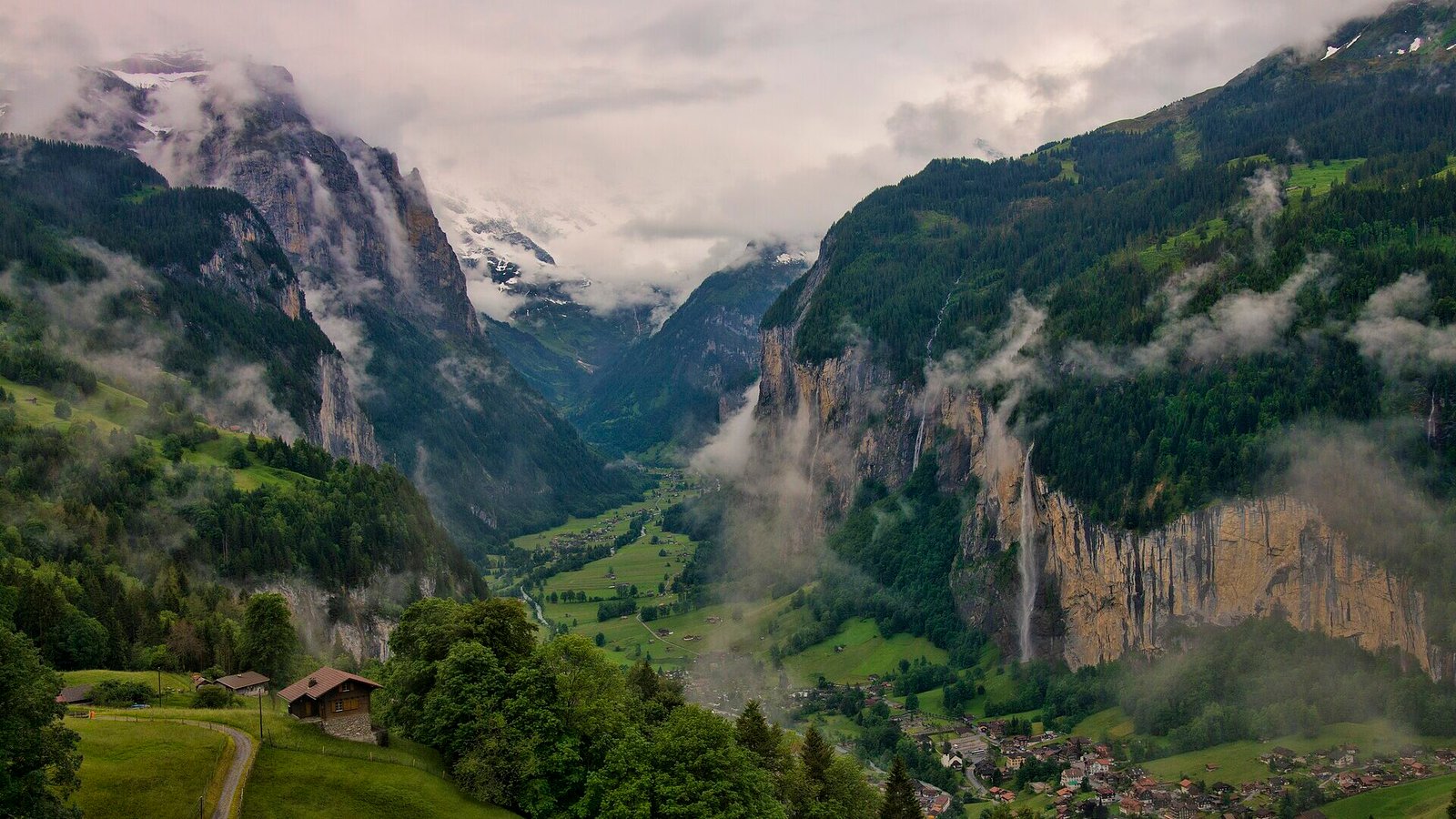 The Lauterbrunnen valley in Switzerland with waterfalls falling from its cliffs
